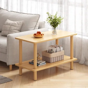 Простой маленький квадратный столик сбоку, несколько маленьких журнальных столиков, простой современный диван, чайный столик в боковом шкафу